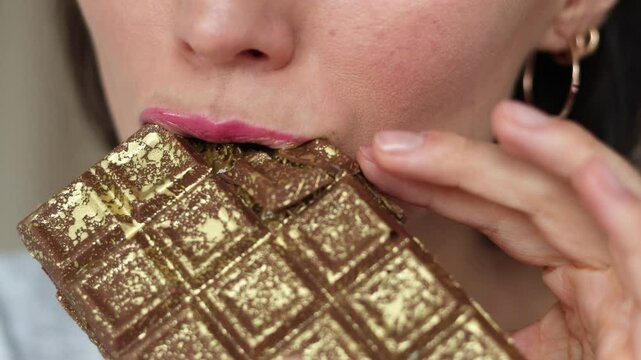 Close up of woman portrait eating handmade Dubai chocolate with green pistachio paste, cream and kataifi dough isolated on white background. Trend dessert. Banner