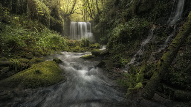 Refreshing morning at the Bustaleguin waterfall in the Pasiegos valleys, Cantabria