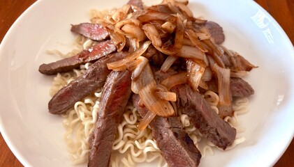 Spaguetti and meat , breakfast meal.