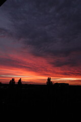 Naklejka premium Orange sunset and clouds
