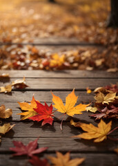 Falling maple leaf's on the empty wooden table top in autumn