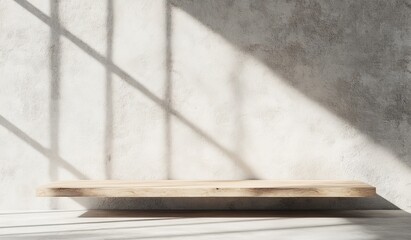 Minimalist wooden shelf against a concrete wall with sunlight.