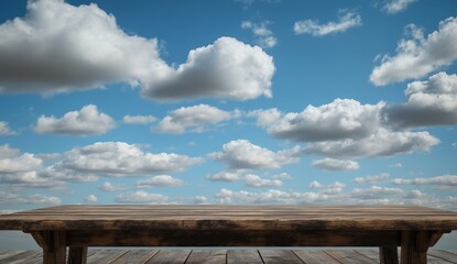 Rustic wooden table against a vibrant blue sky with fluffy clouds.