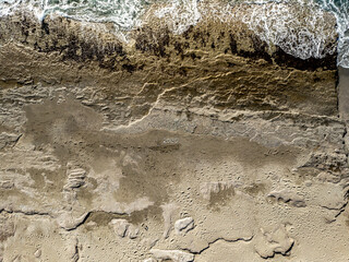 Aerial View of 2025 Written on Sandy Beach with Waves by the Sea