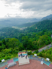 Aerial drone view of  mountain viewpoint surrounded with greenery rainforest at Wang Kelian, Perlis, Malaysia.