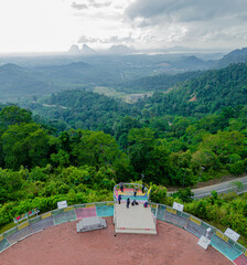 Aerial drone view of  mountain viewpoint surrounded with greenery rainforest at Wang Kelian, Perlis, Malaysia.