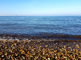 Pebble beach of the Baltic Sea in the evening light.