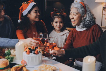 Happy multigeneration family enjoying in opening gifts on Christmas eve at home.