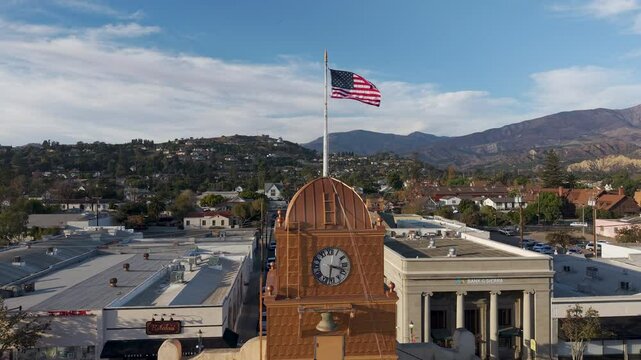 The Town Clock - drone circling around the Odd fellows lodge clock tower on Main street in Santa Paula, CA