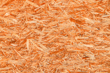 The texture of the OSB material, the recycled pressed wood chips, the texture of plywood. close up