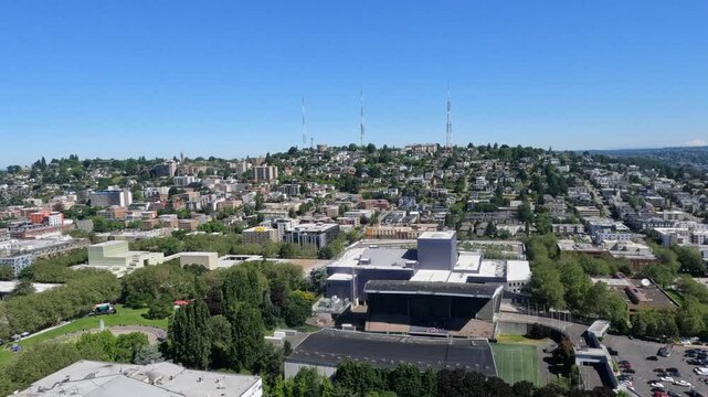 Seattle, Washington, aerial video footage, climbing in front of Queen Anne Hill District, located west of Lake Union, with office and apartment building and radio antennas on top of hill