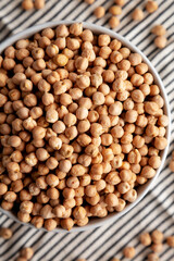 Dry Organic Chickpeas in a Bowl, top view. Flat lay. overhead, from above.