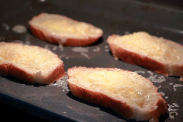 Fresh Cheese Toast Baking In A Tray In The Oven.