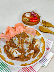 Ketoprak is a typical Indonesian food. Ketoprak food consists of pieces of ketupat, tofu, vermicelli, bean sprouts, and sprinkled with peanut sauce.