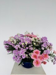 Floral arrangement with pink, purple and white tones for a new year to celebrate luck, prosperity and a good fortune