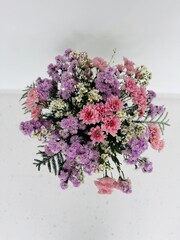 Floral arrangement with pink, purple and white tones for a new year to celebrate luck, prosperity and a good fortune