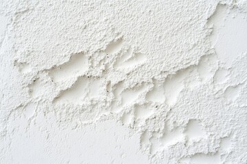 White textured wall with damage and imperfections.