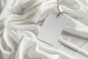 Blank tag on white silk fabric. (9)