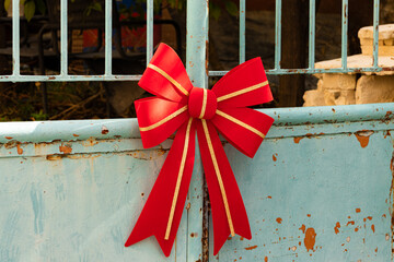 Christmas holiday red and gold bow decoration
