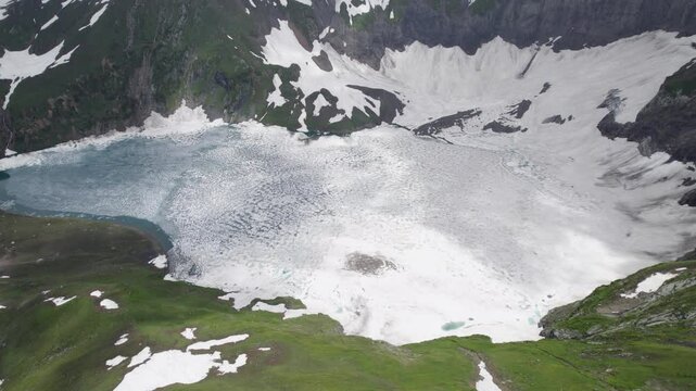 Chitta Katha lake in Neelum valley, a serene frozen lake surrounded by snow