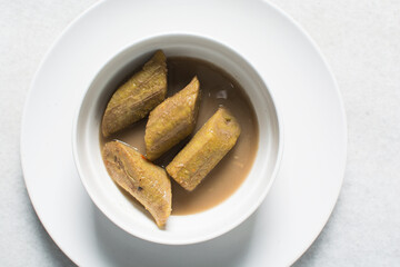 Overhead view of boiled unripe plantain, top view of cooked plantain