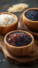 Closeup of various spices seasonings and grains in wooden bowls on a dark rustic background  Diverse selection of natural organic ingredients for cooking baking or creating gourmet meals