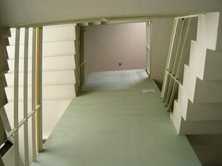 A staircase architecturally connecting upper and lower floors, creating a vertical link between spaces.