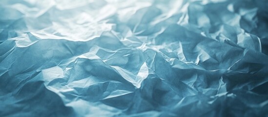 Obraz premium Crumpled and Wrinkled Paper Texture in Soft Dreamy Blue Tones Evoking a Serene Atmospheric and Minimalist Concept Delicate Fragile and Elegant Background with a Tactile Shimmering Surface