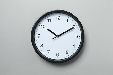 Big beautiful stylish clock on gray background