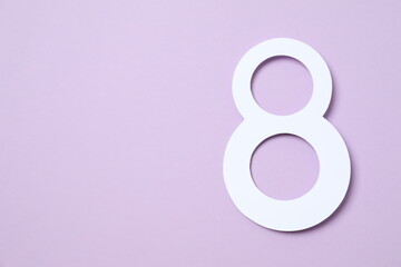 Number 8 on a color background. Minimal Women's day, March 8th or birthday concept. Flat lay, top view.