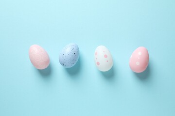 Happy Easter card. Easter eggs and decoration on color background, top view