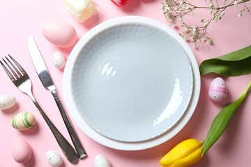 Easter decor concept. Top view photo of colorful eggs in a plate on pastel background