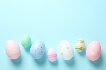 Happy Easter card. Easter eggs and decoration on color background, top view