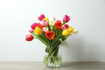 Beautiful fresh tulips in a vase on the table