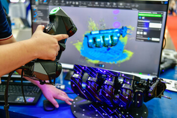 Portable 3D Auto parts handheld scanner is scanning to measure size and texture for future product development production in the automotive industry