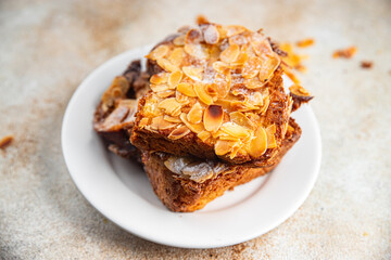 Brioche sweet almond french toast fresh tasty food dish delicious gourmet food background on the table rustic food top view copy space