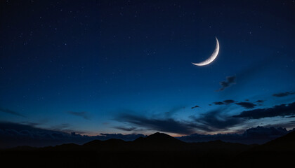 Obraz premium Crescent moon illuminated against starry night sky