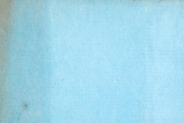 Old weathered blue paper with stains