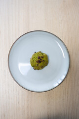 One green tea matcha cookie on the plate.