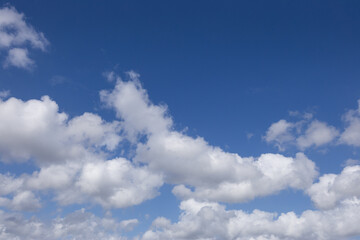 Obraz premium White clouds on the blue sky.