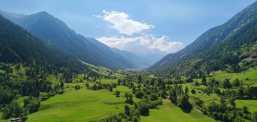 Serene mountain valley landscape. Lush green meadows nestled between towering peaks under a vibrant blue sky. Ideal for travel, nature, and tourism.