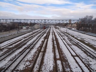 Railway tracks covered with snow in the winter. View from above.