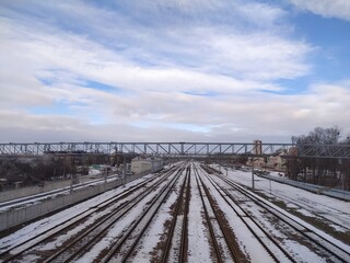 Railway tracks in the winter with blue sky