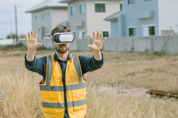 Engineer male worker using VR visual reality technology in construction industry.