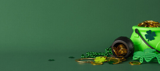 Minimalistic side view green background with pot of gold, shamrocks, and coins symbolizing St. Patrick's Day