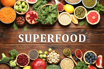 Superfood. Different healthy food products on wooden table, flat lay