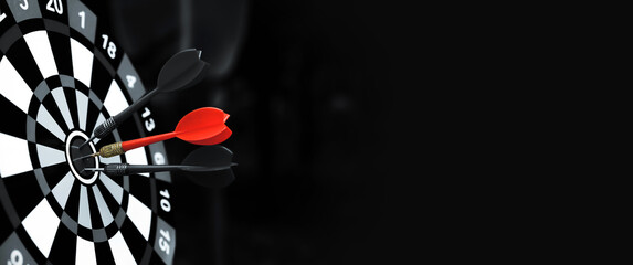 Dark bulls eye target or bullseye have red dart arrows throw hitting challenge the center of a...