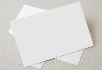Blank white postcard on textured background for stationery and design mockups