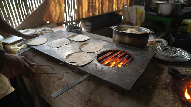 Dough of wheat changed to fresh rotis in a roadside hotel.