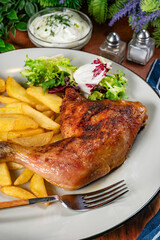 Appetizing baked chicken leg quarter.